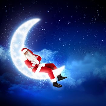Photo of Santa Claus sitting on shiny moon above winter forest