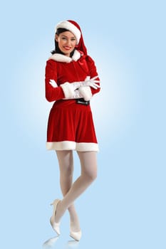 Portrait of beautiful young woman wearing santa claus clothes