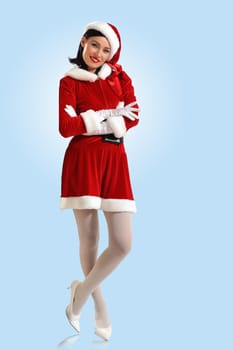 Portrait of beautiful young woman wearing santa claus clothes