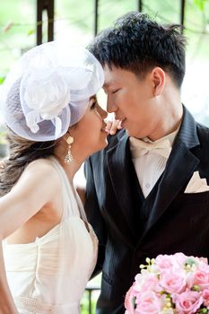 Portrait of Happy Romantic Newlyweds Couples kissing for wedding background