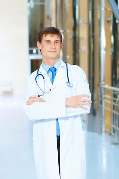 Portrait of friendly male doctor in hospital smiling