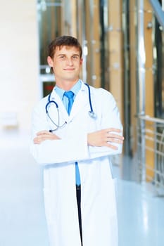 Portrait of friendly male doctor in hospital smiling