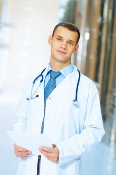 Portrait of friendly male doctor in hospital smiling