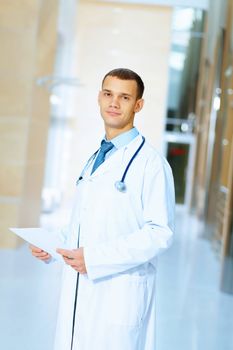 Portrait of friendly male doctor in hospital smiling