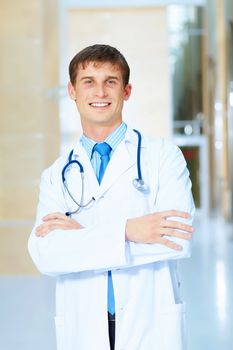 Portrait of friendly male doctor in hospital smiling