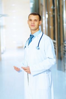 Portrait of friendly male doctor in hospital smiling