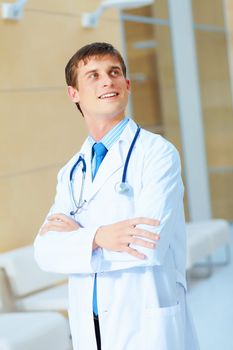 Portrait of friendly male doctor in hospital smiling