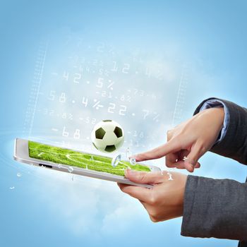 Modern wireless technology illustration with a computer device and football ball