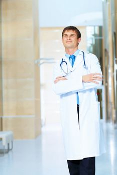 Portrait of friendly male doctor in hospital smiling