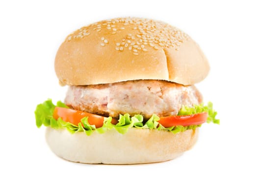 big hamburger with tomato , lettuce and fried pork