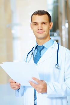 Portrait of friendly male doctor in hospital smiling