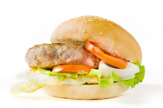 burger with fresh vegetable , fried  egg, fried pork