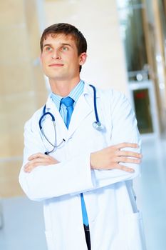 Portrait of friendly male doctor in hospital smiling