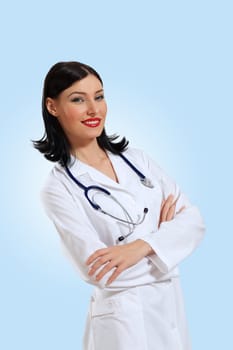 Portrait of happy successful young female doctor holding a stethoscope