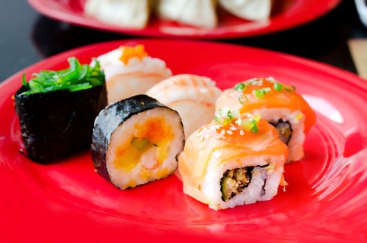 lots of various Japanese sushi and  sushi rolls