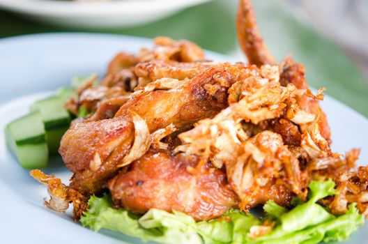 deep fried  chicken  with fried garlic  and fresh vegetable