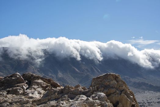 clouds over the mountains in nature parc de Teide on Tenerife