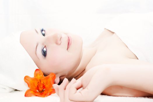 A woman relaxes after getting a massage at a day spa
