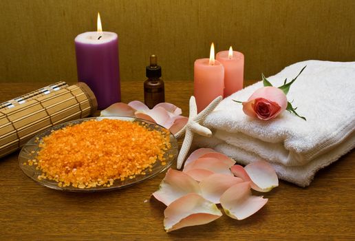 Bath salt, towel and a pink rose. Subject spa treatments