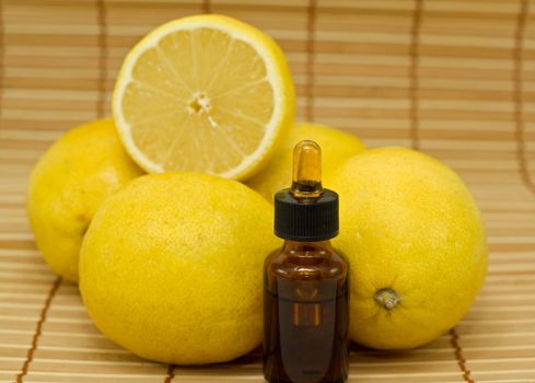 Bottle of essential oil from lemon - alternative medicine
