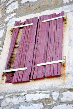 Old wooden shutters on the building