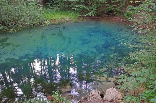 Blue lake in the forest (Beului lake in Nera gorges)