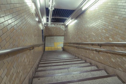 well illuminated underground stairs in Tokyo
