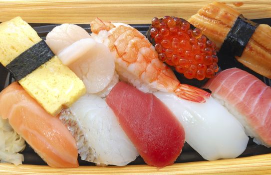 traditional Japanese Sushi set, seafood, raw fish and some kind of snack with rice balls