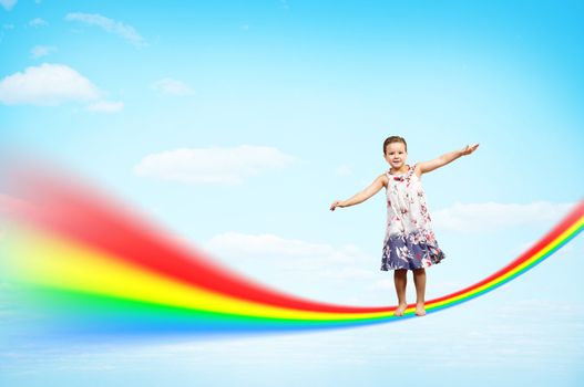 girl jumping on clouds and a rainbow, collage, place for text
