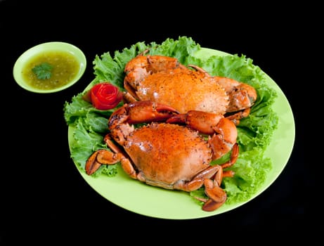 Steamed crabs a great tasty seafood display on dish isoated on black background 