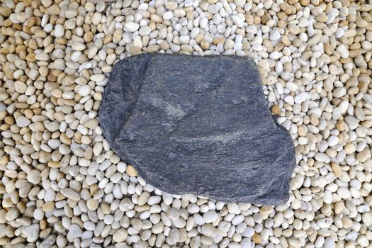 big stone on the detailed small white pebbles background