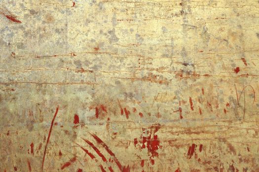 ancient temple wall background with scratched golden color over old red painting