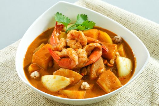 Thai spicy concentrated curry with shrimps and spicy herbs isolated, 