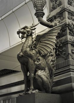 sculpture of Japanese Dragon at very famous Nihombashi Bridge under city lamp in Tokyo, Japan 
