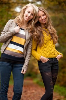 2 girls are having fun in the forest