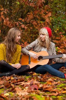 2 girls are having fun in the forest