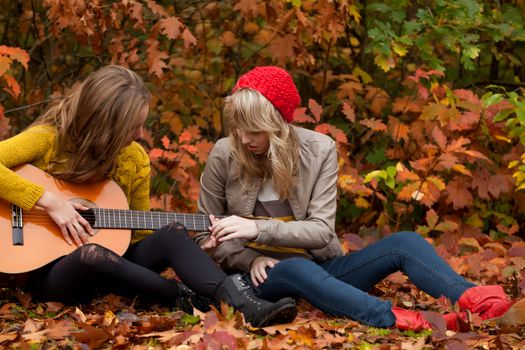 2 girls are having fun in the forest