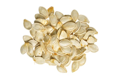 Closeup of pile of fresh raw whole pumpkin seeds isolated on white