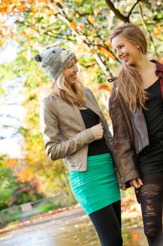 2 girls are having fun in the forest