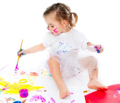 cute little girl with a brush and paints