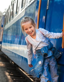 Smiling little girl on train