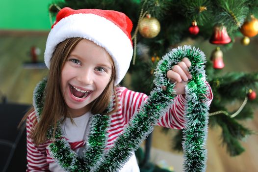 portrait of adorable happy christmas child in santa hat