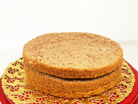 Chocolate layer cake, in slices, isolated on a golden paper