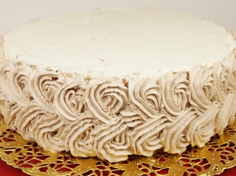 Closeup of a chocolate cream layer cake