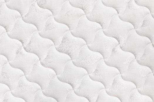 Background of soft comfortable quilted white mattress