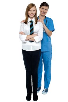 Full length portrait of a doctor with her patient. All against white background.