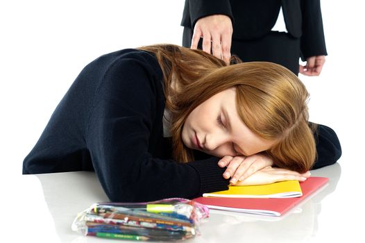 Teacher waking up a dozed off student. Indoor studio shot.