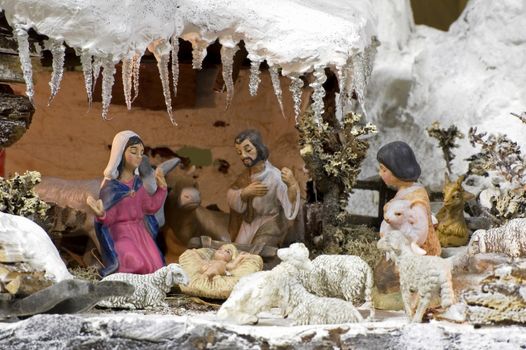 Traditional Christmas Crib with snow on the roof