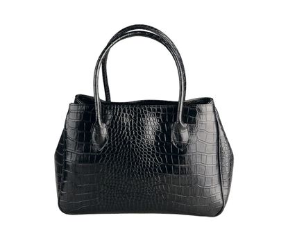 Beautiful black leather handbag made from crocodile leather isolates on white 
