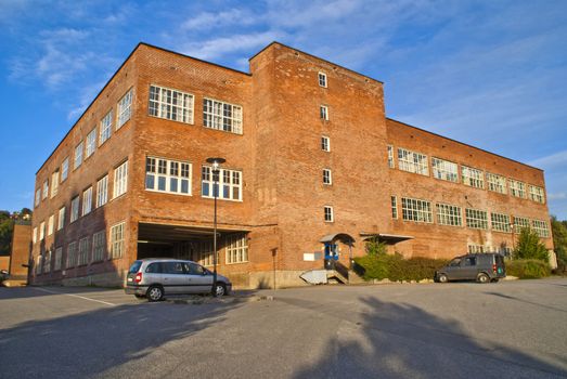 paper mill in Halden (Norway) which is the oldest wood processing plant in Norway, image is shot from the Tista river that flows past the factory. 